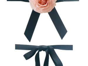 Black ribbon bows with pink rose centerpiece