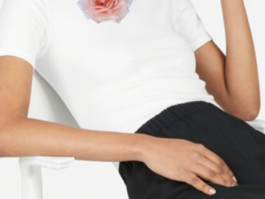 White top with pink rose brooch