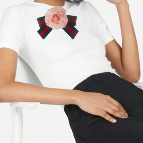 White top with pink flower and striped bow