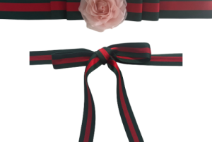 Green and red striped ribbon with pink flower